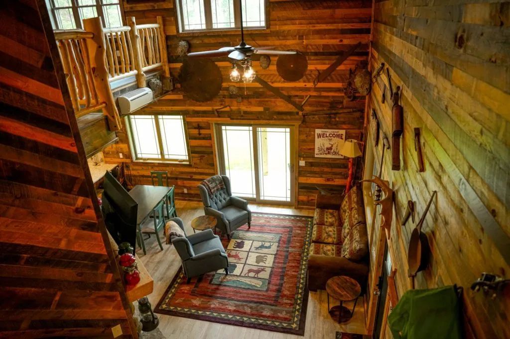 An aerial view of a living room in a log cabin.