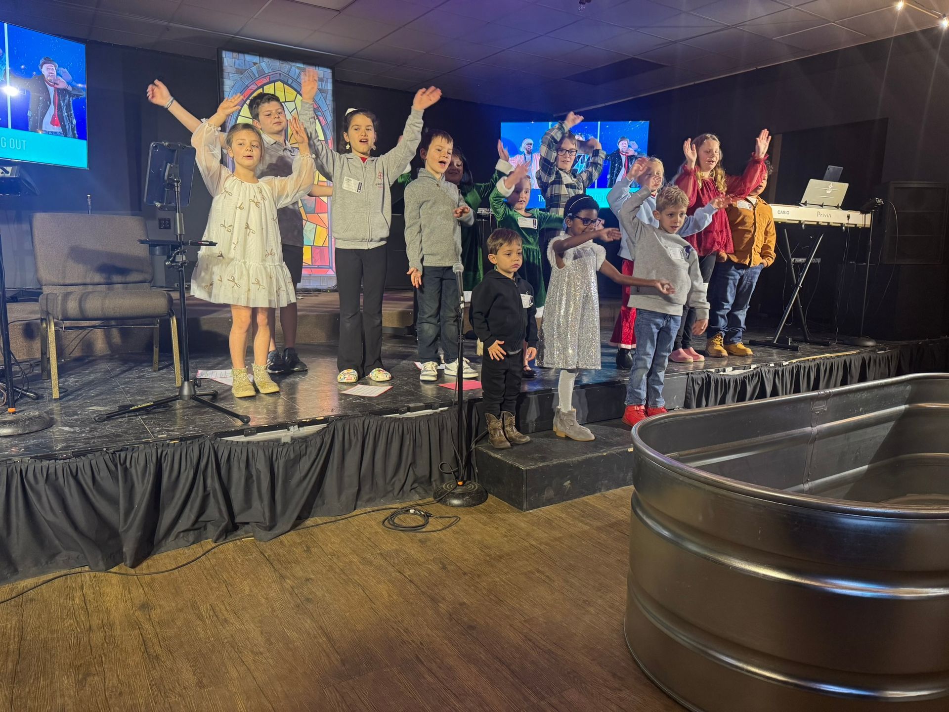 A group of children are playing in a playground in a park