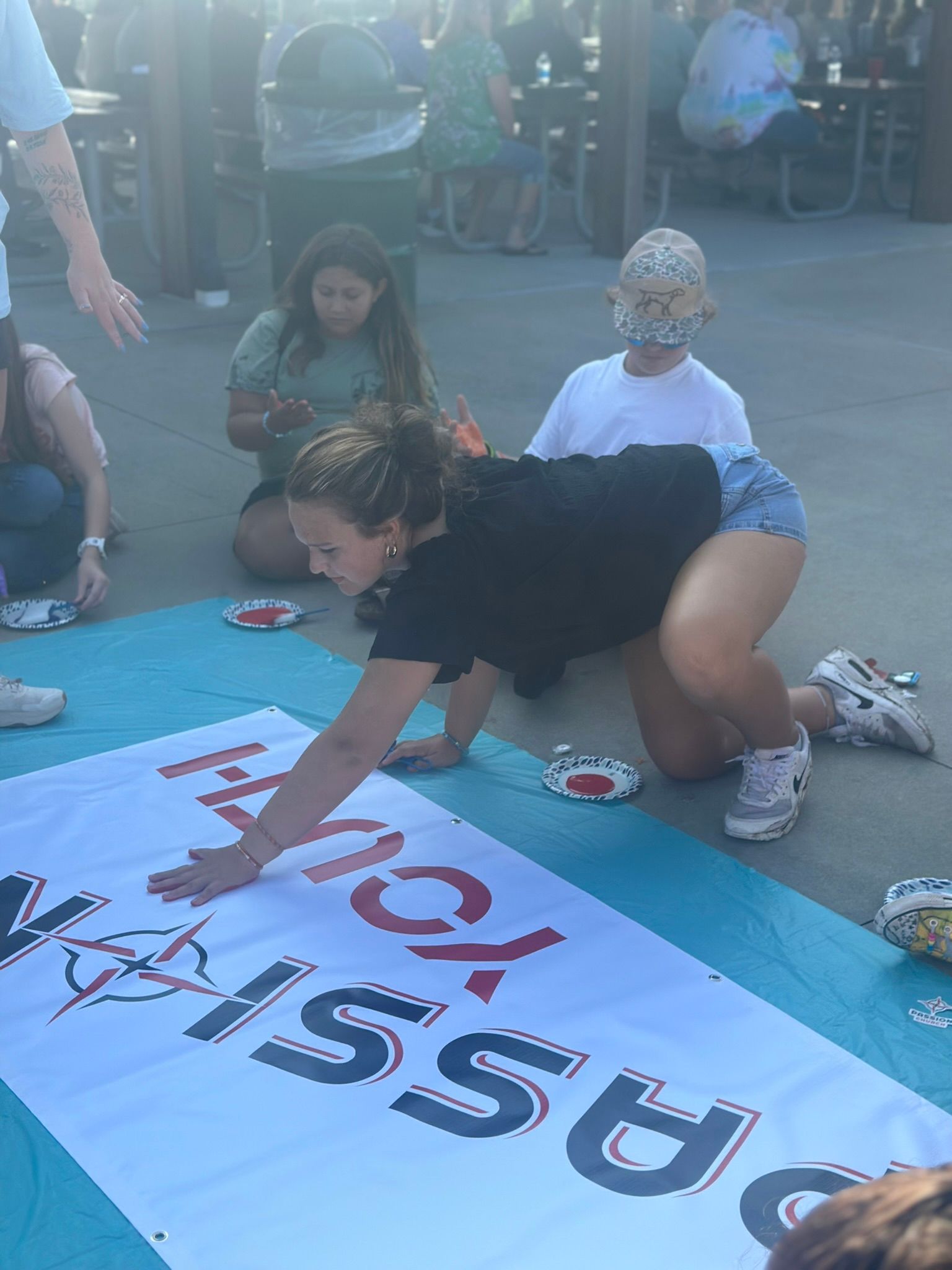 A group of people are playing a game on the ground.