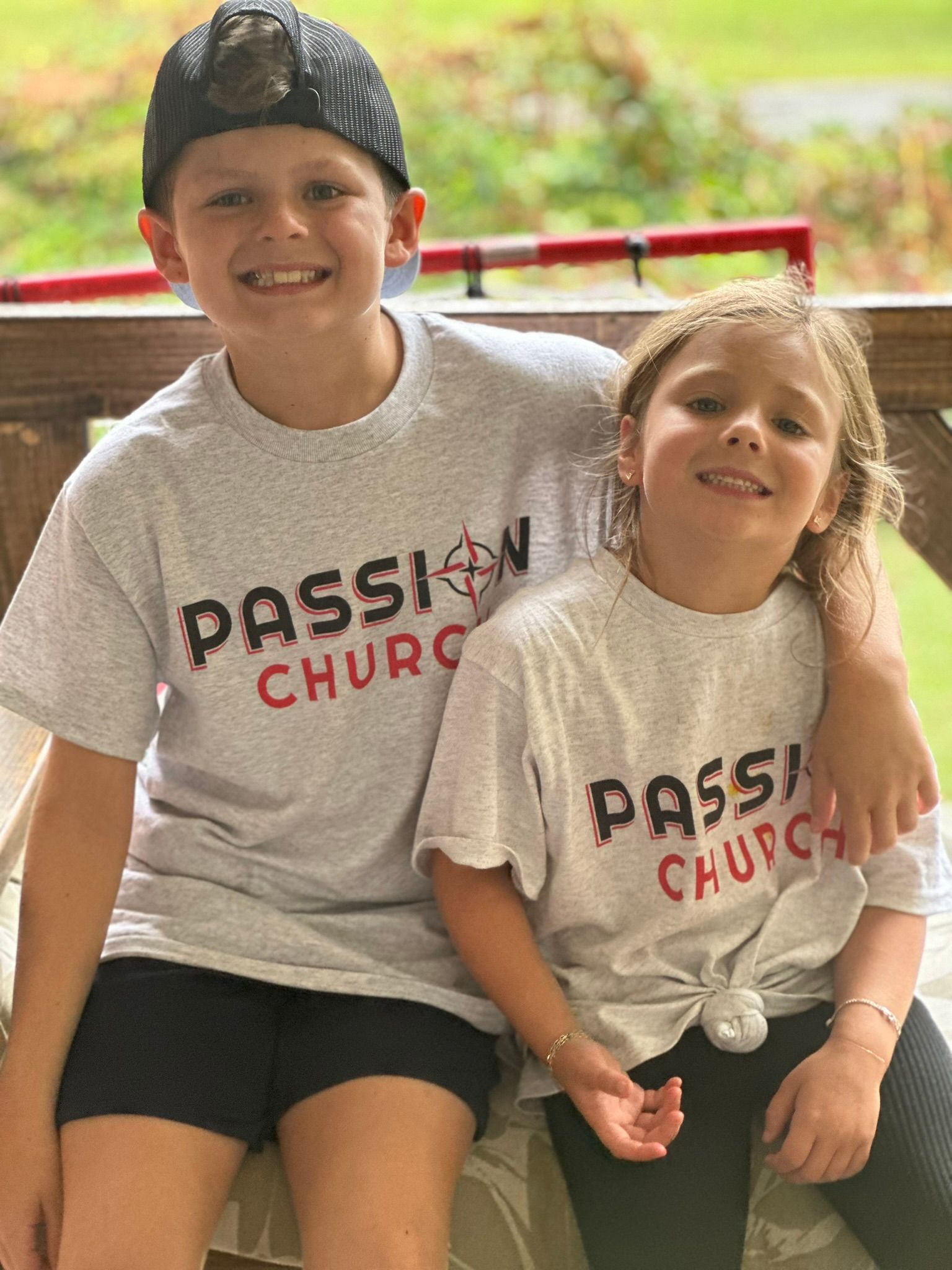 A group of children are playing in a playground in a park