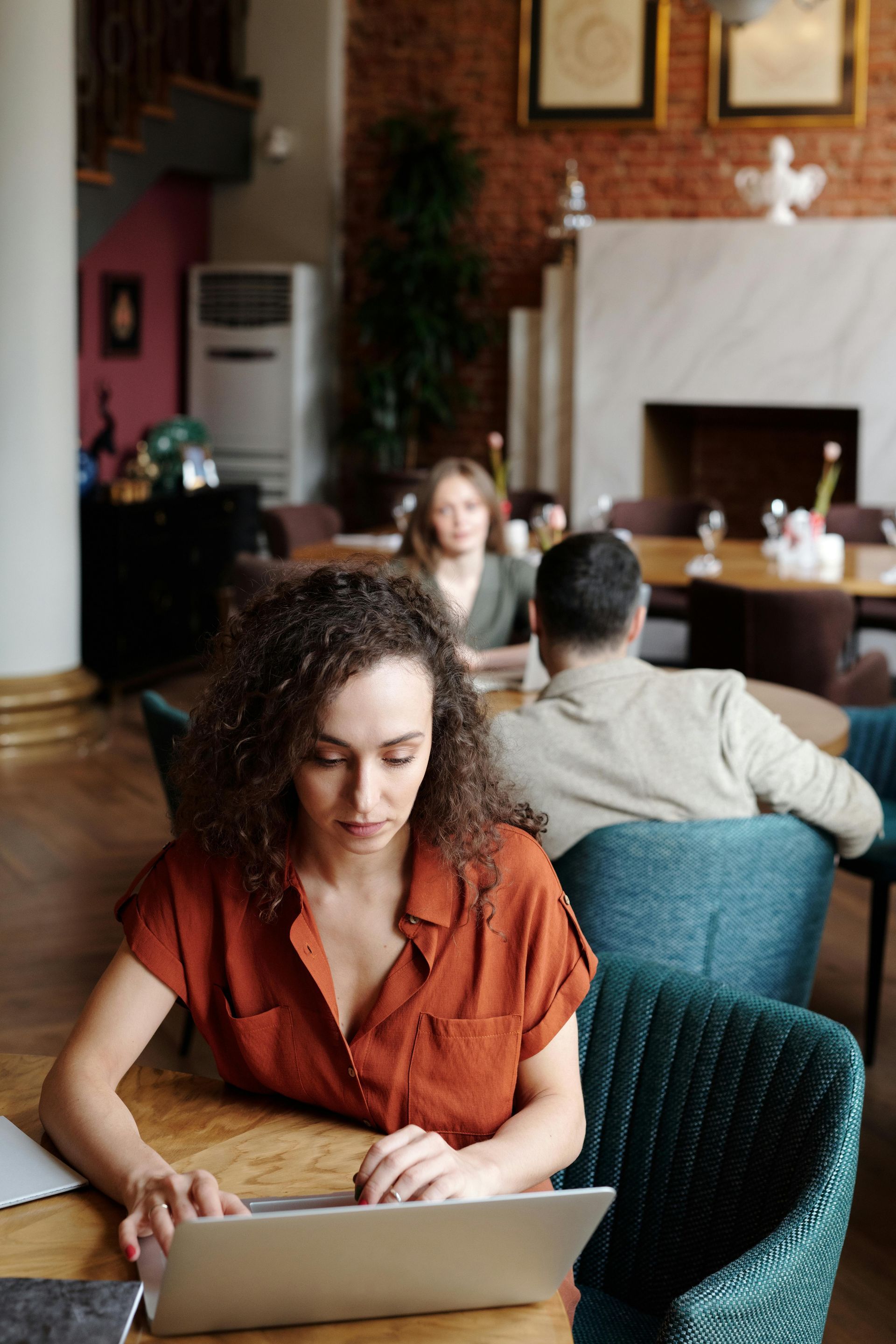 Small business owner reviewing firewall service information on a laptop