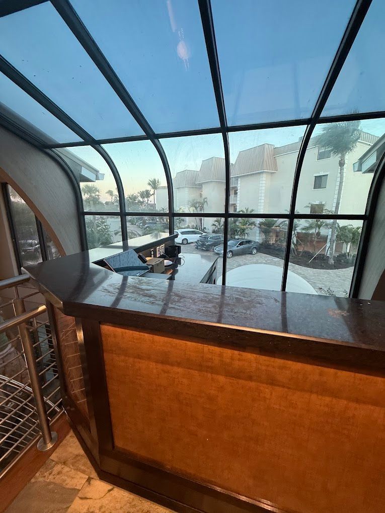 A view of a city from a balcony with a glass roof