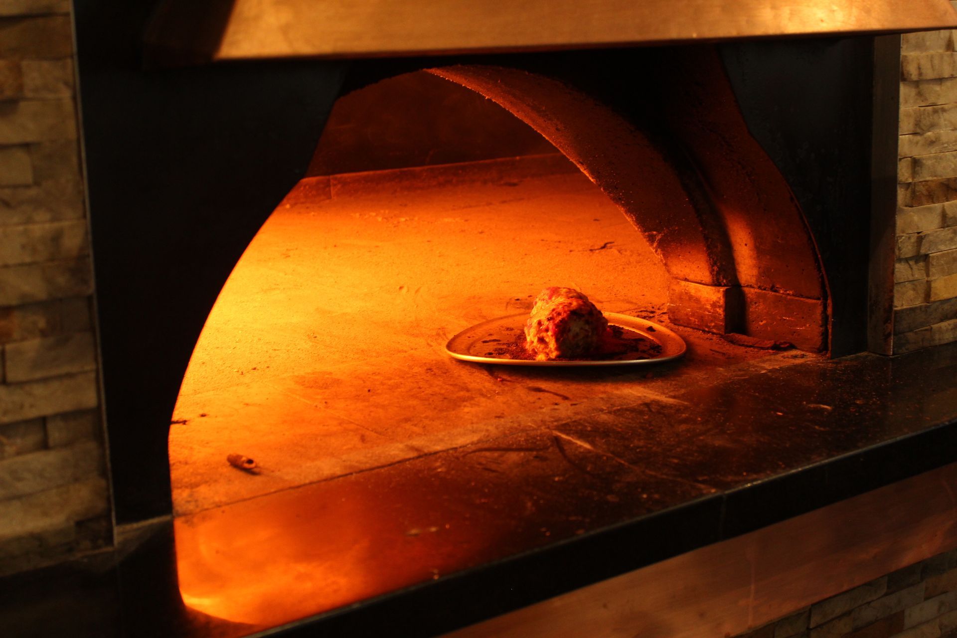 A plate of food is being cooked in an oven.