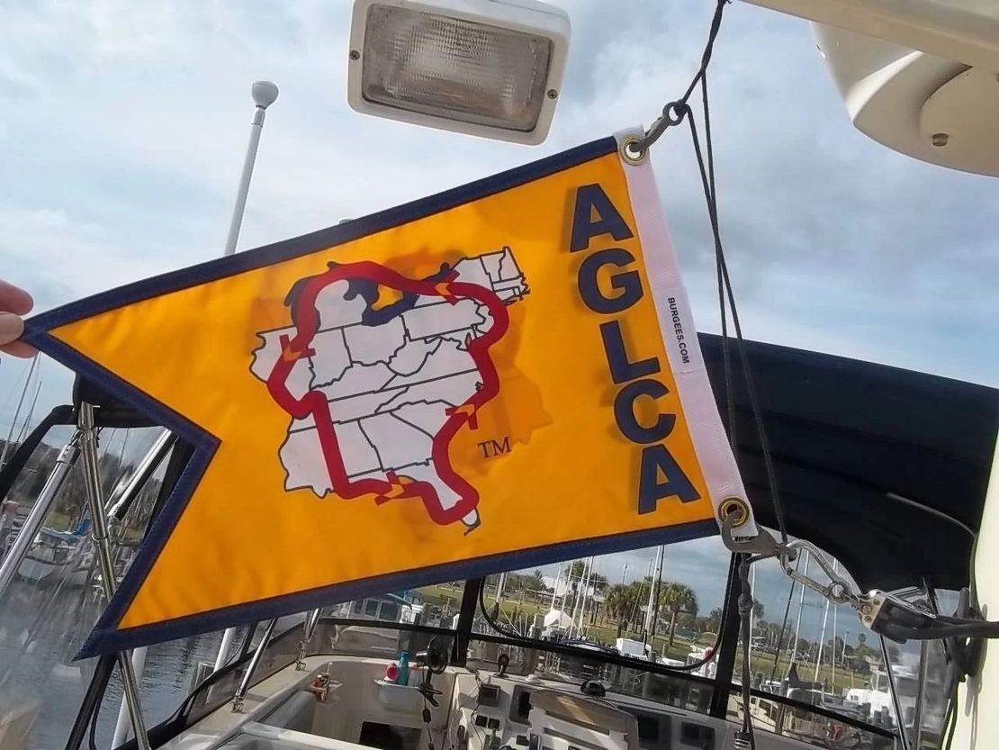 A yellow flag with the word aglca on it