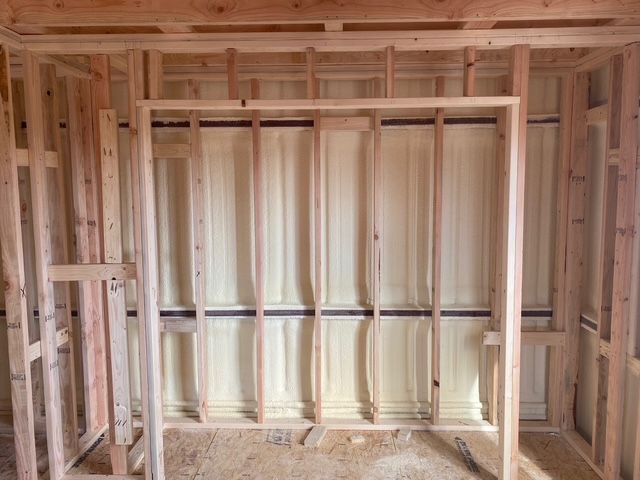 Interior wooden framing with spray foam insulation.