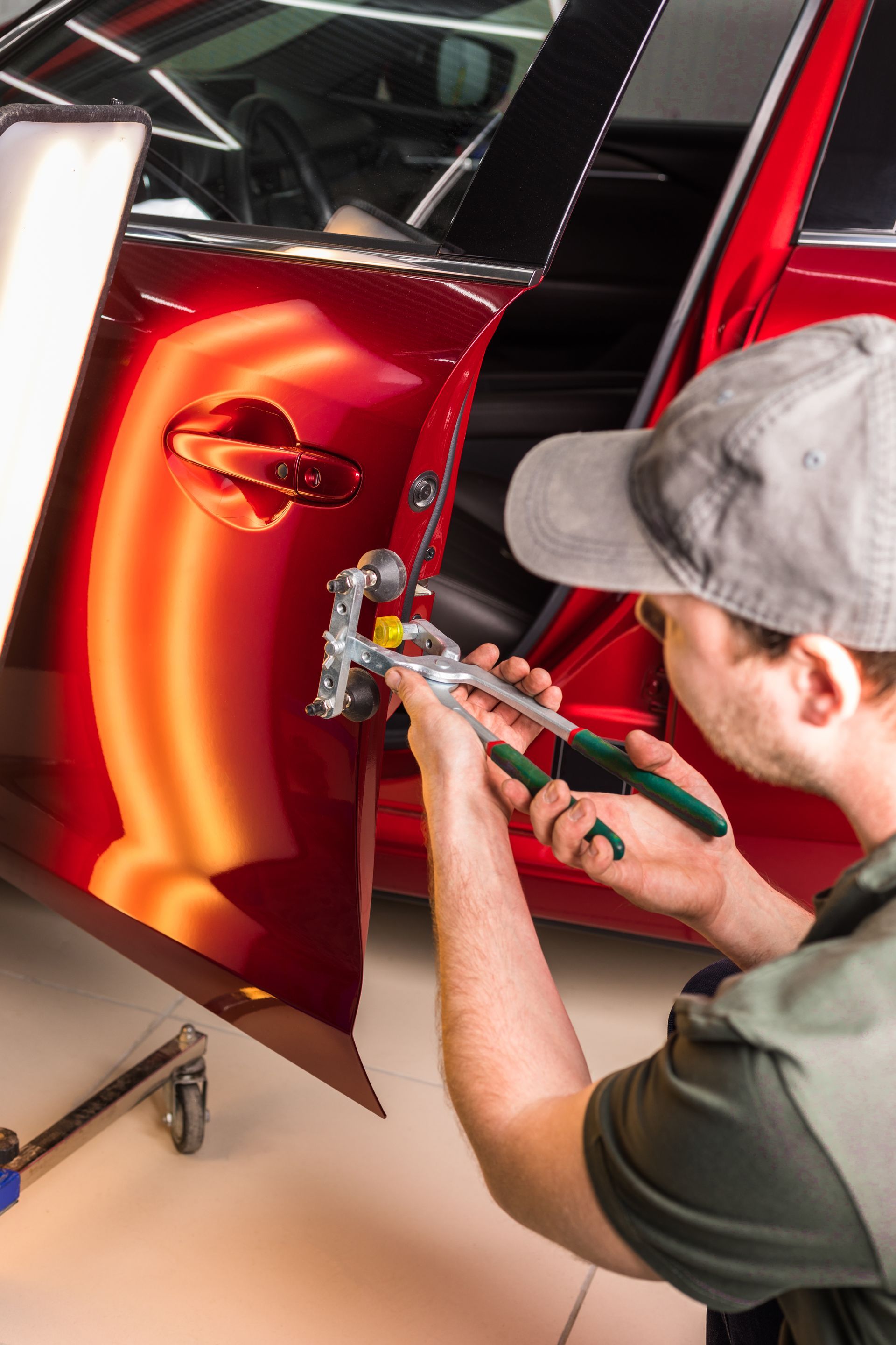roanoke rim repair removing a dent from a car door