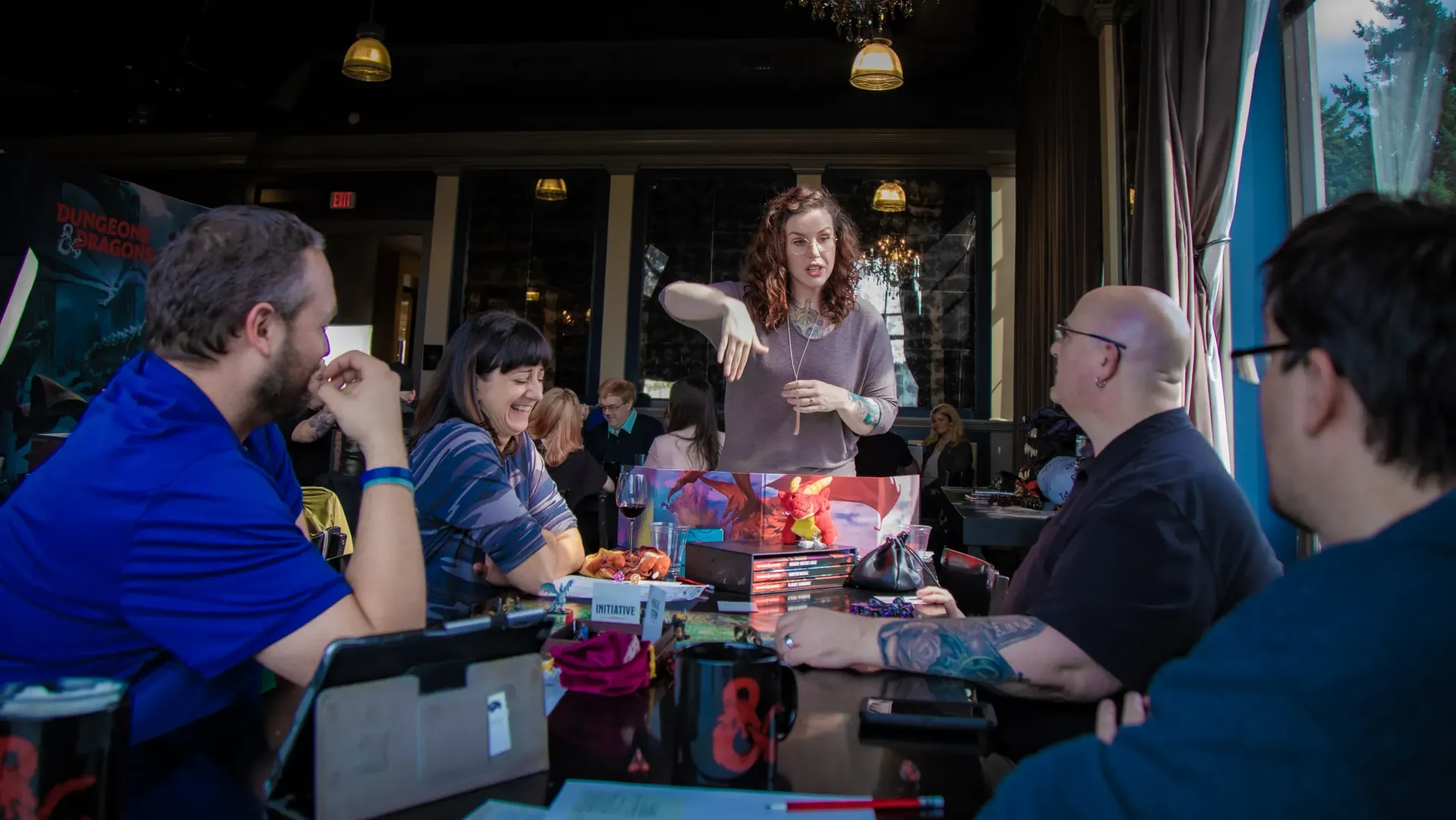 A person is holding a pineapple in a bag in a grocery store.