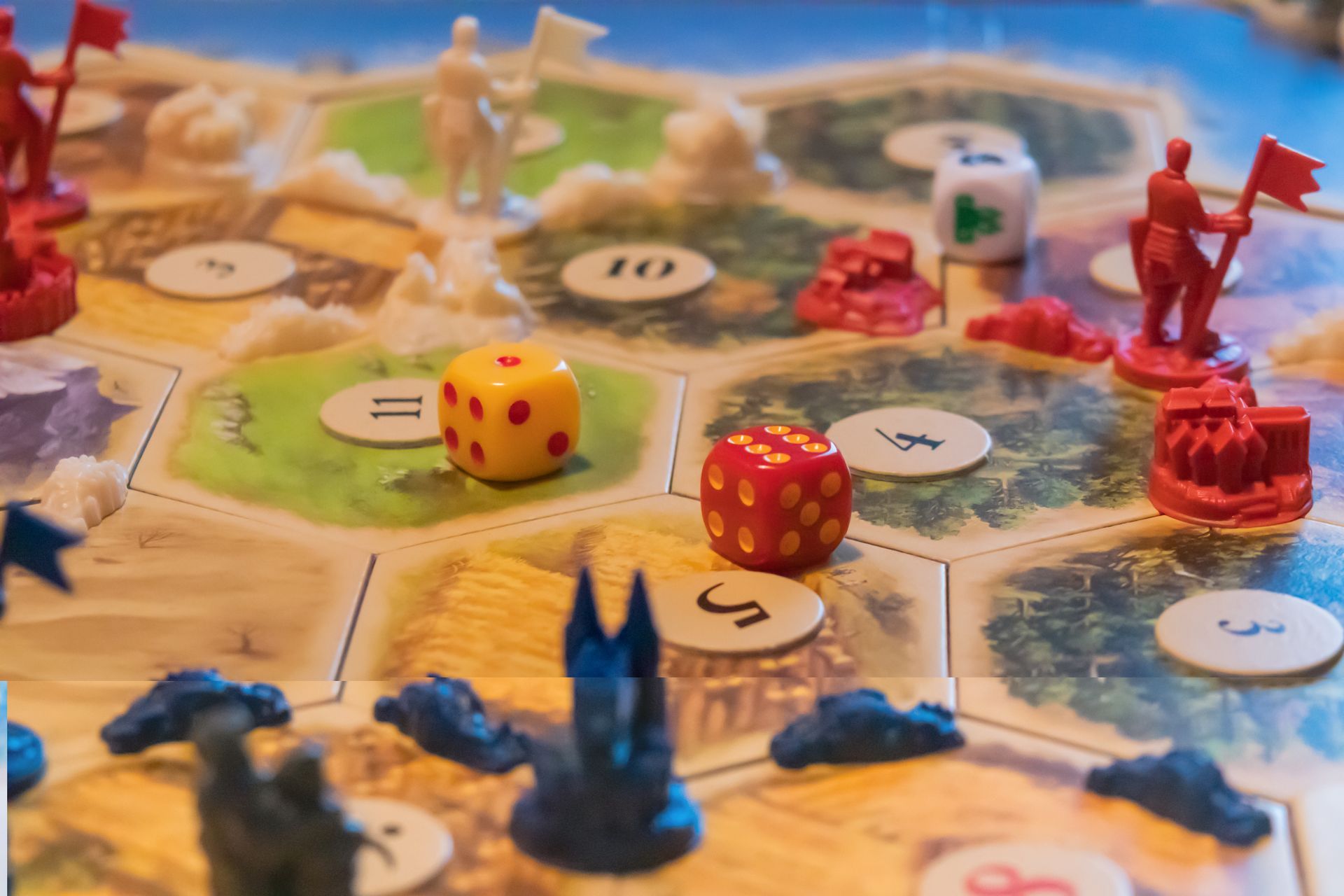 A person is holding a pineapple in a bag in a grocery store.