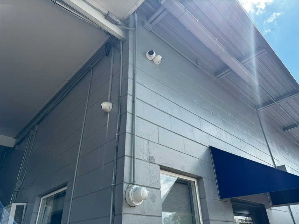 A building with a blue awning on the side of it.