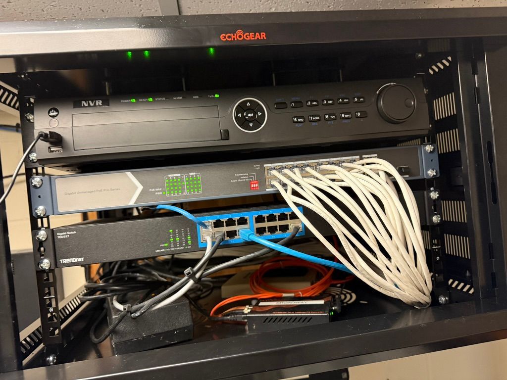 A server rack with a lot of wires coming out of it