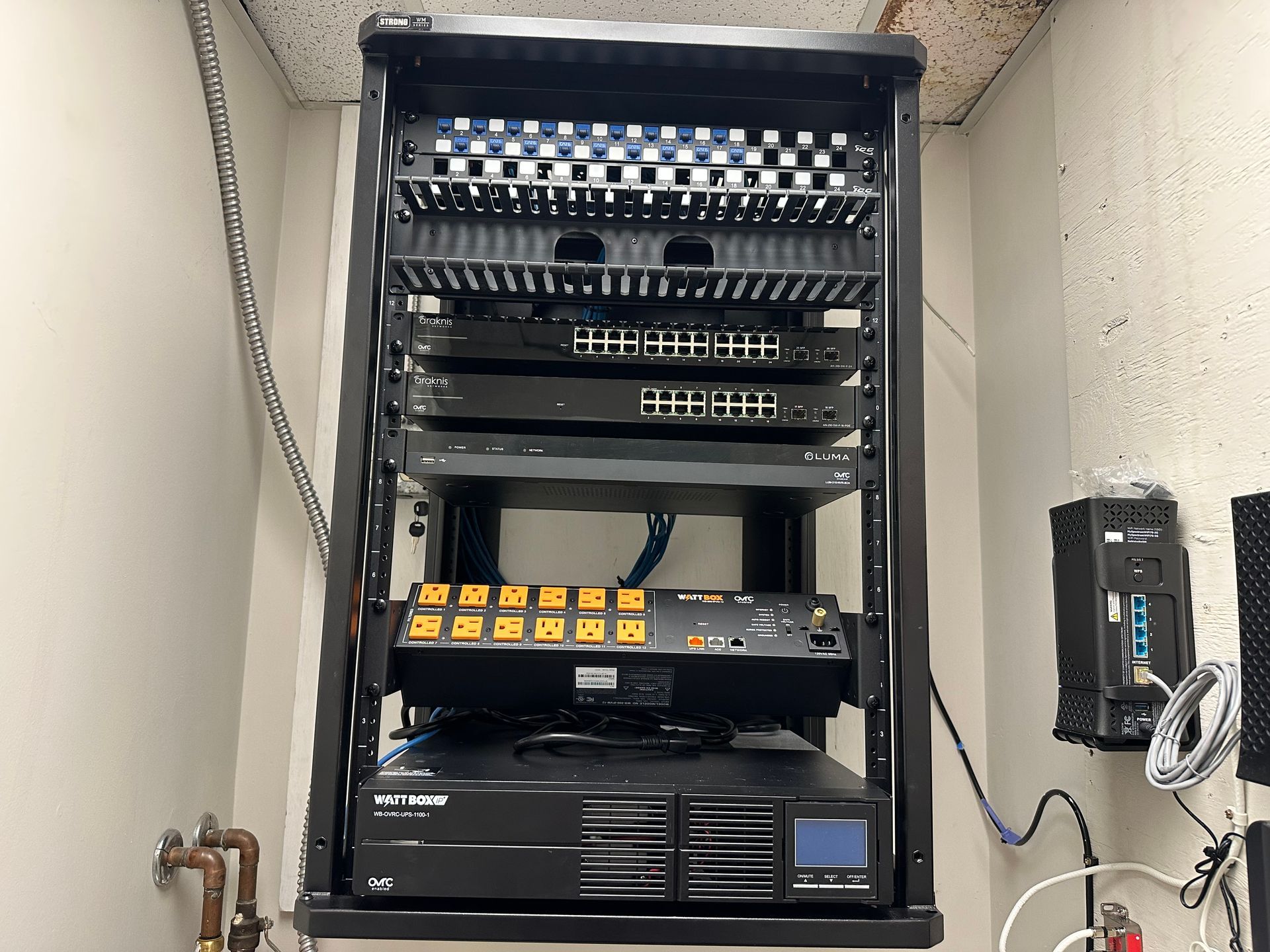 A server rack with a lot of electronics on it