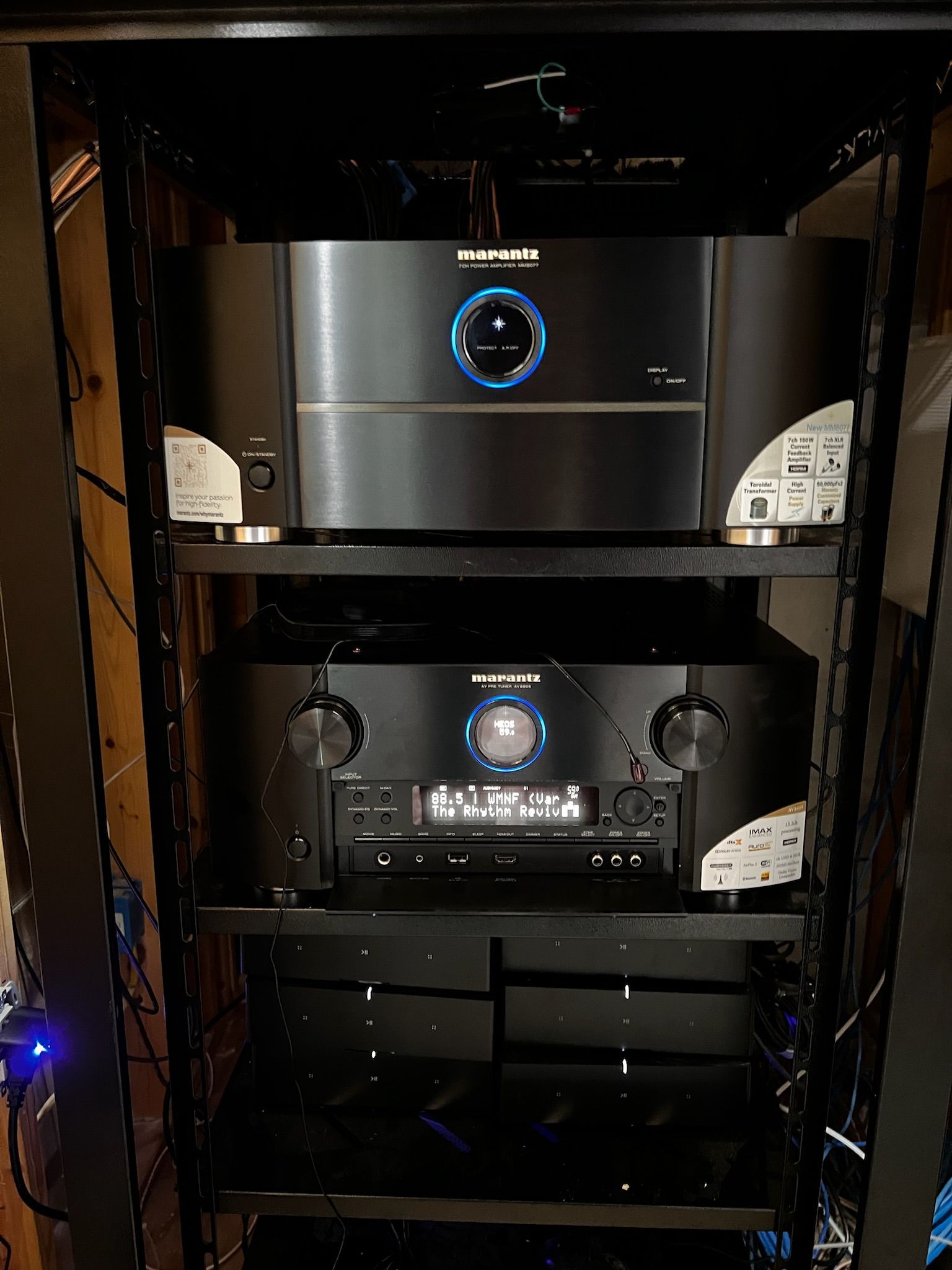 A rack with a bunch of electronics on it.