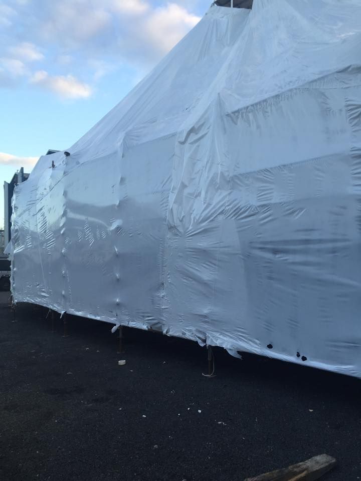 Large, White Object Covered in Plastic Wrap — T & T Scaffolding in Cassowary Coast QLD
