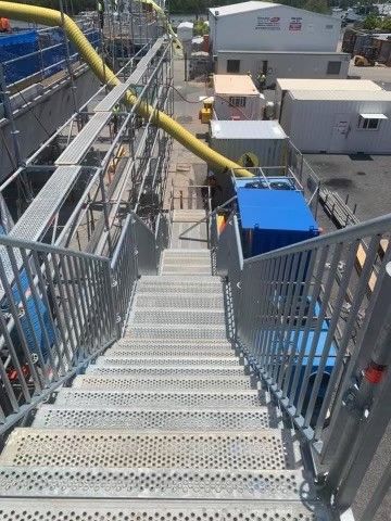 A Set Of Stairs Leading Down to a Construction Site — T & T Scaffolding in Gordonvale, QLD