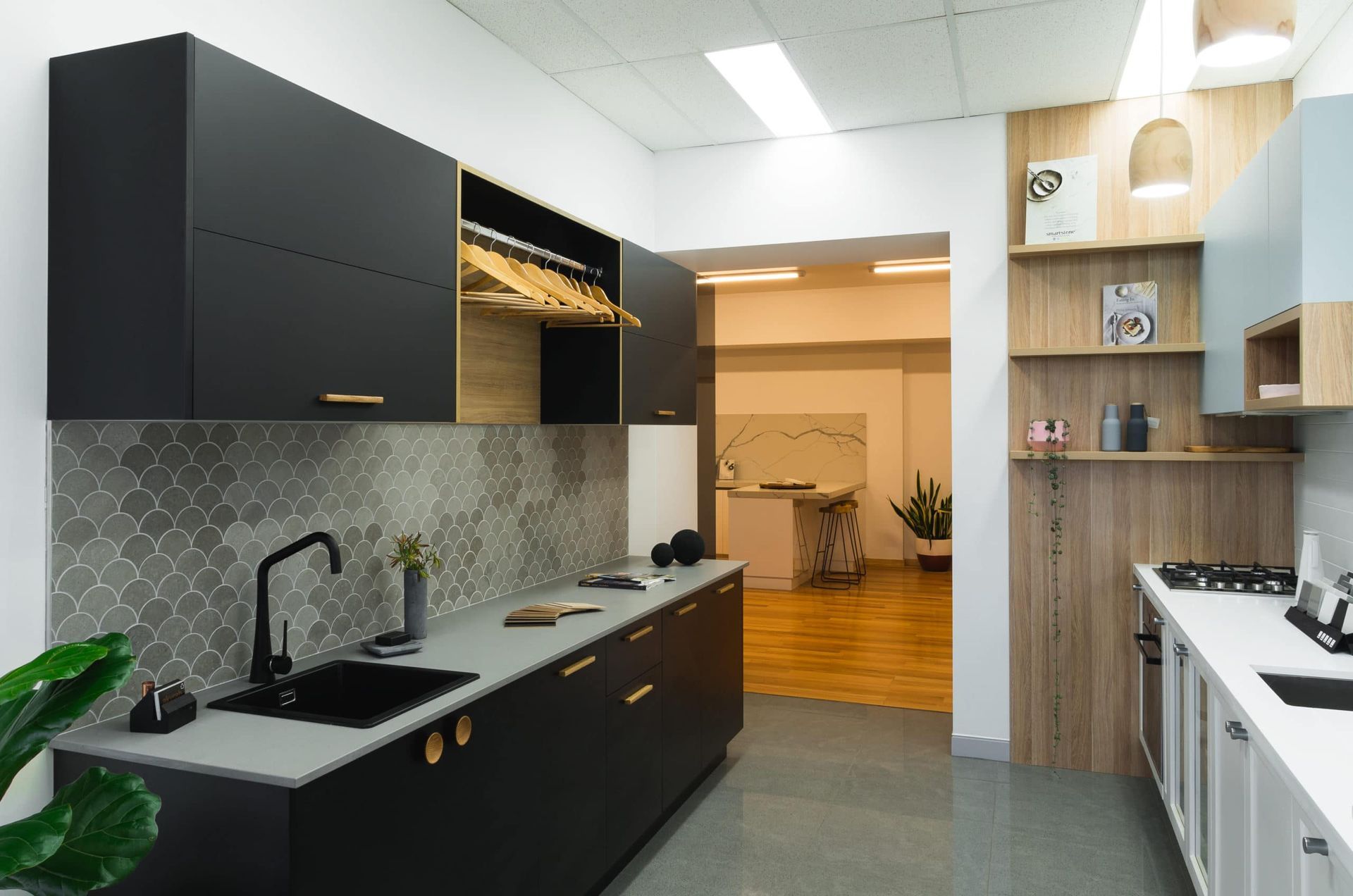 Modern Kitchen With Black Cabinets, Gray Countertops, and Gray Backsplash — Akyrah Kitchens in Gympie, QLD