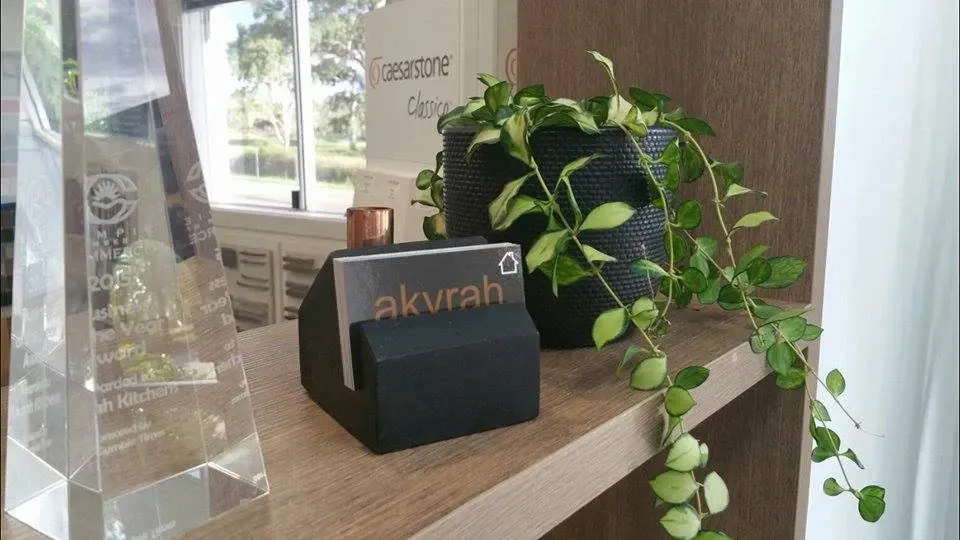 Black business card holder with the word