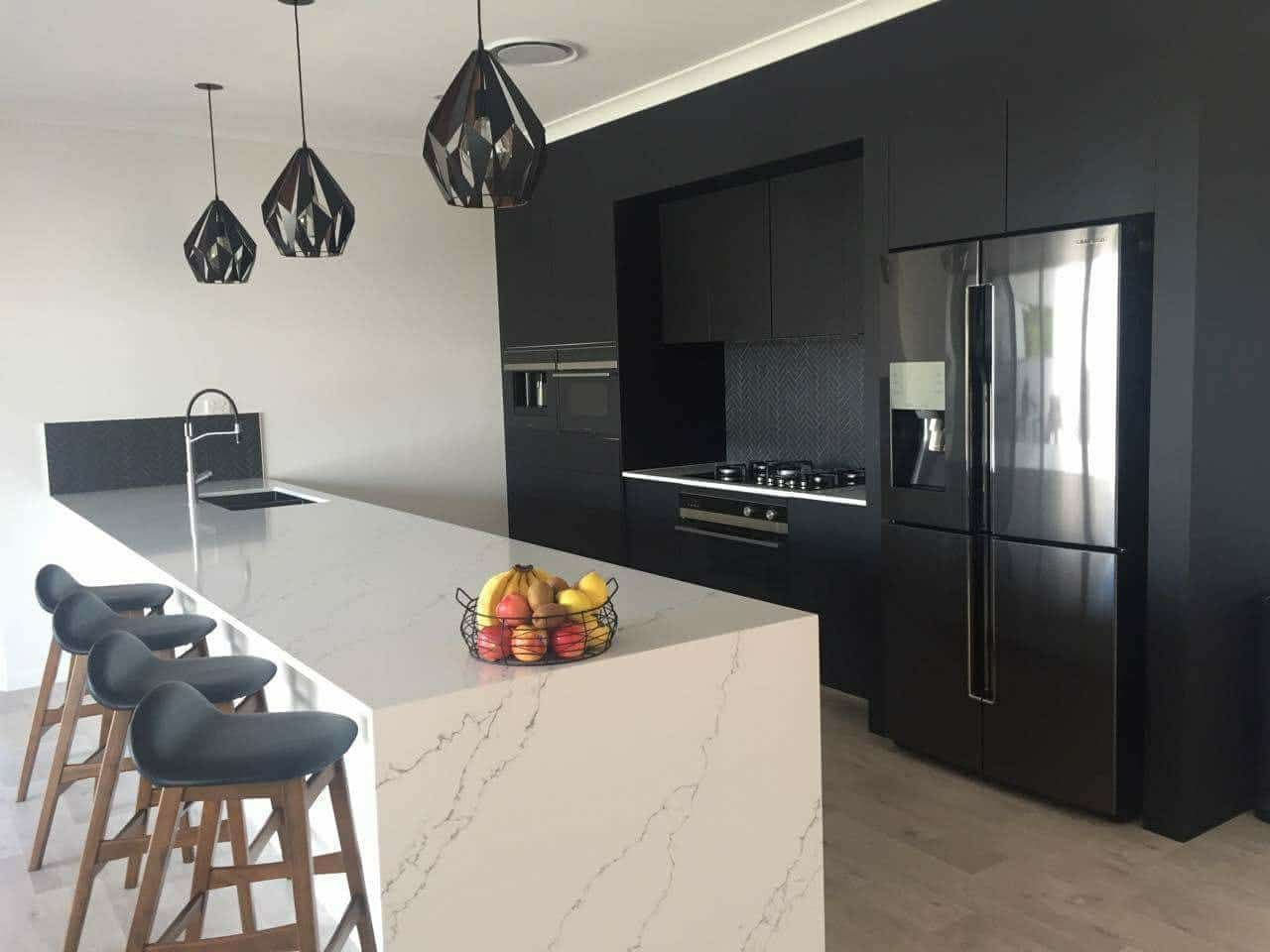 Modern Kitchen With Black Cabinetry, White Countertops, and Bar Stools — Akyrah Kitchens in Gympie, QLD