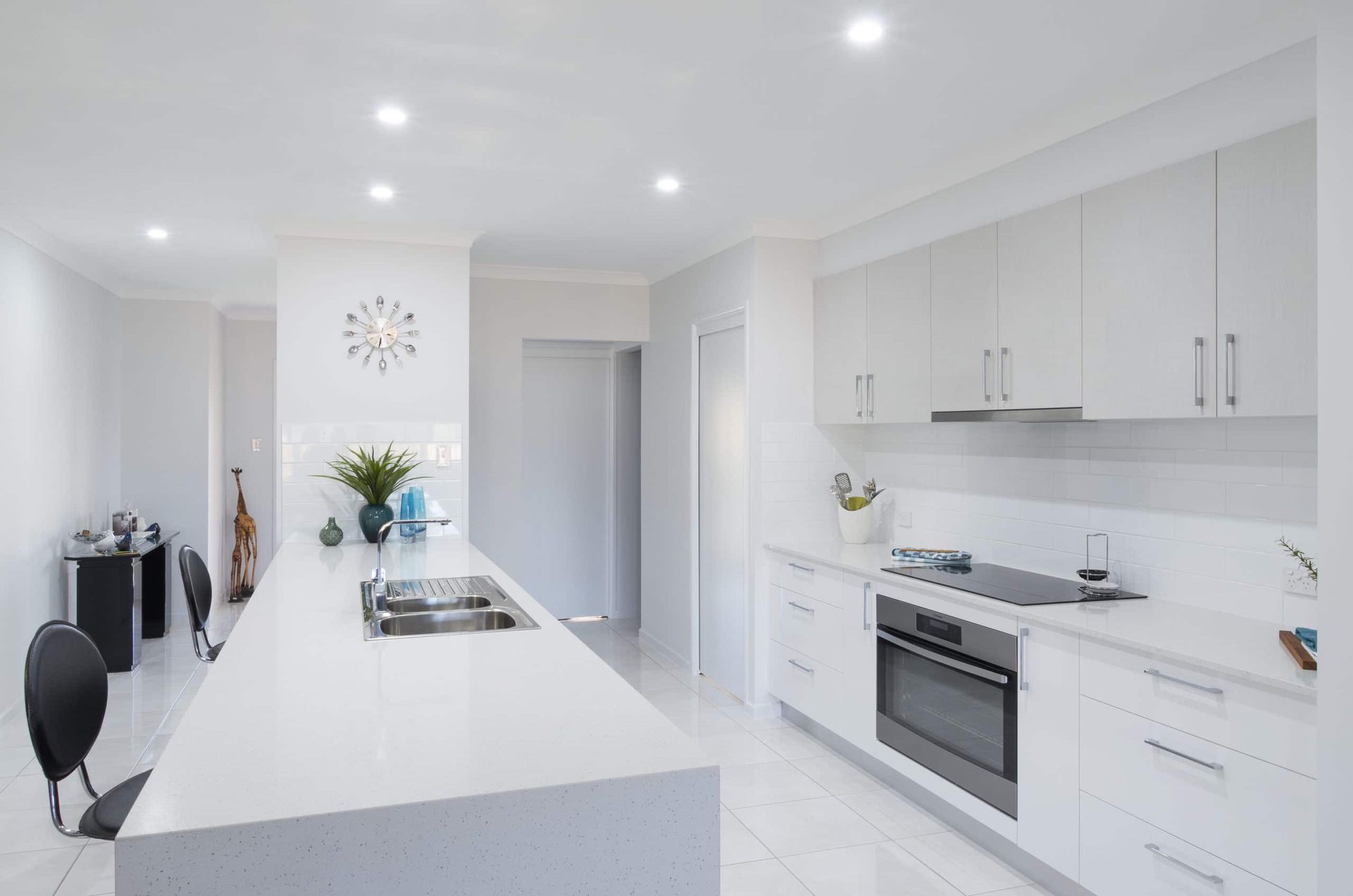 White Modern Kitchen With Island, Cabinets, Oven, and Recessed Lighting — Akyrah Kitchens in Gympie, QLD