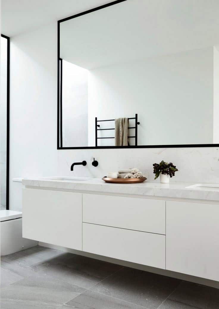 Modern White Bathroom With a Floating Vanity, Black-framed Mirror, and a Wall-mounted Faucet — Akyrah Kitchens in Gympie, QLD