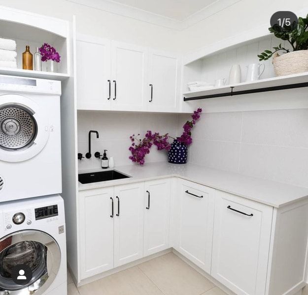 White Laundry Room With Stacked Washer/dryer, Cabinets, and a Sink — Akyrah Kitchens in Gympie, QLD