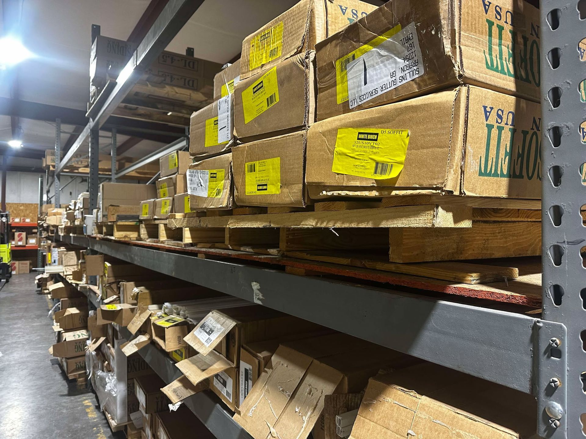 A hammer and nails on a wooden surface