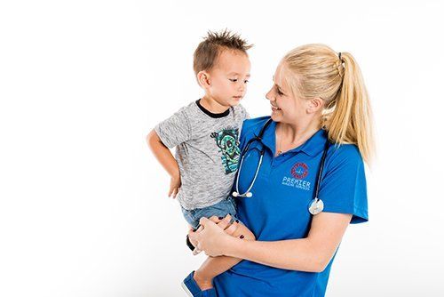 Nurse taking care of a young child