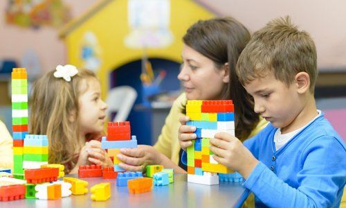 children playing building blocks