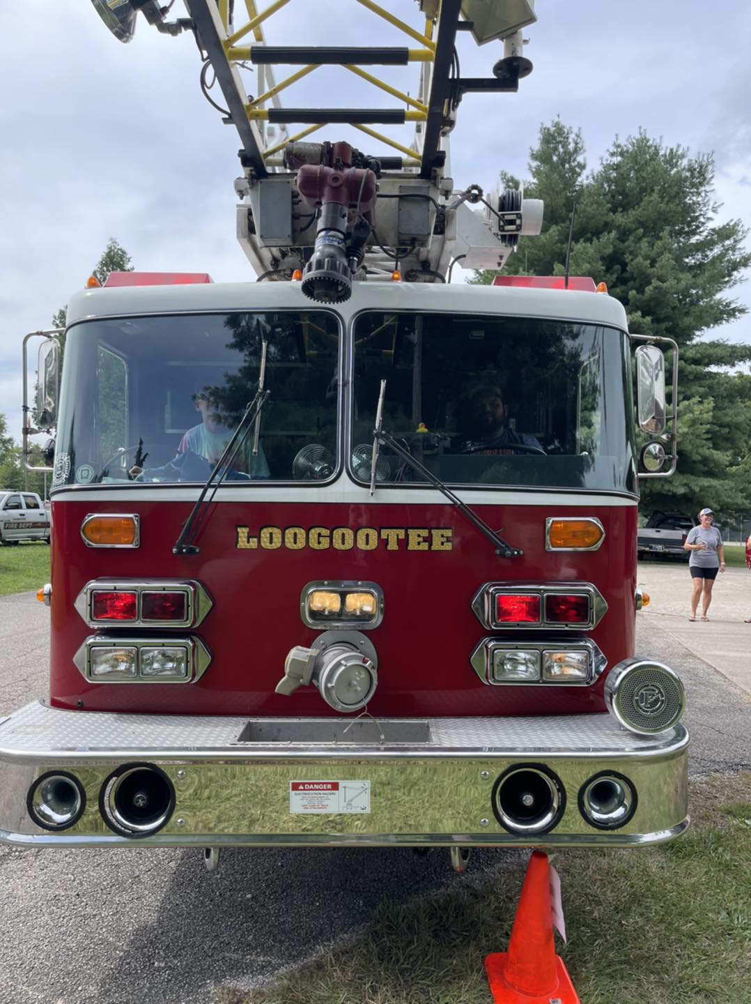 A red fire truck is parked on the side of the road.