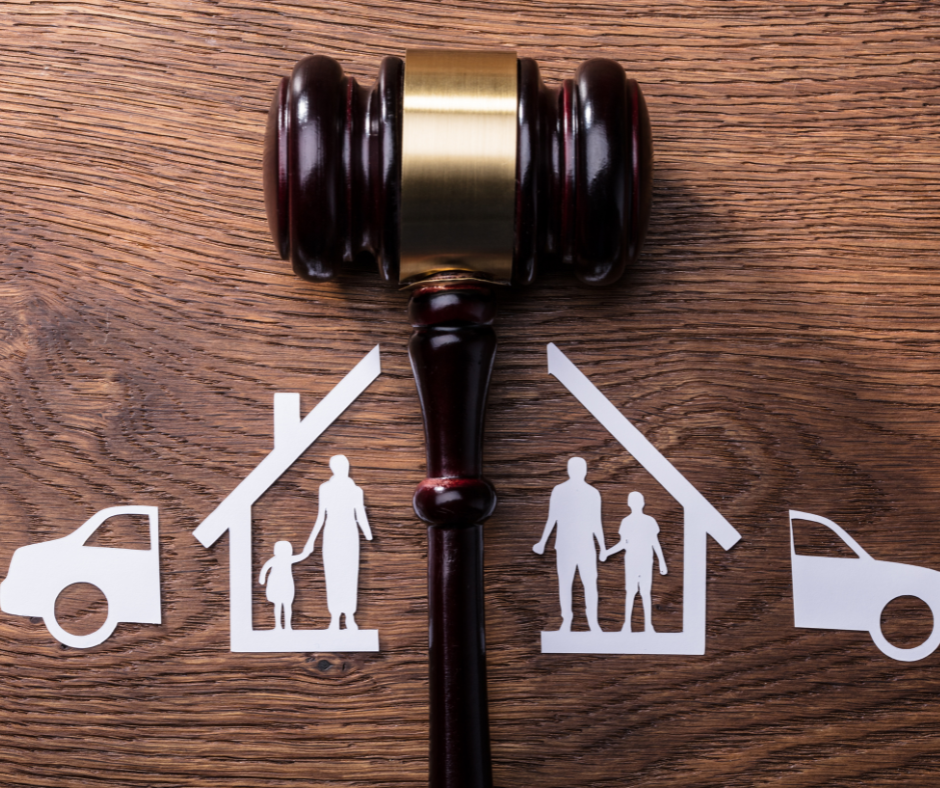 Paper cutouts of family and house divided by gavel