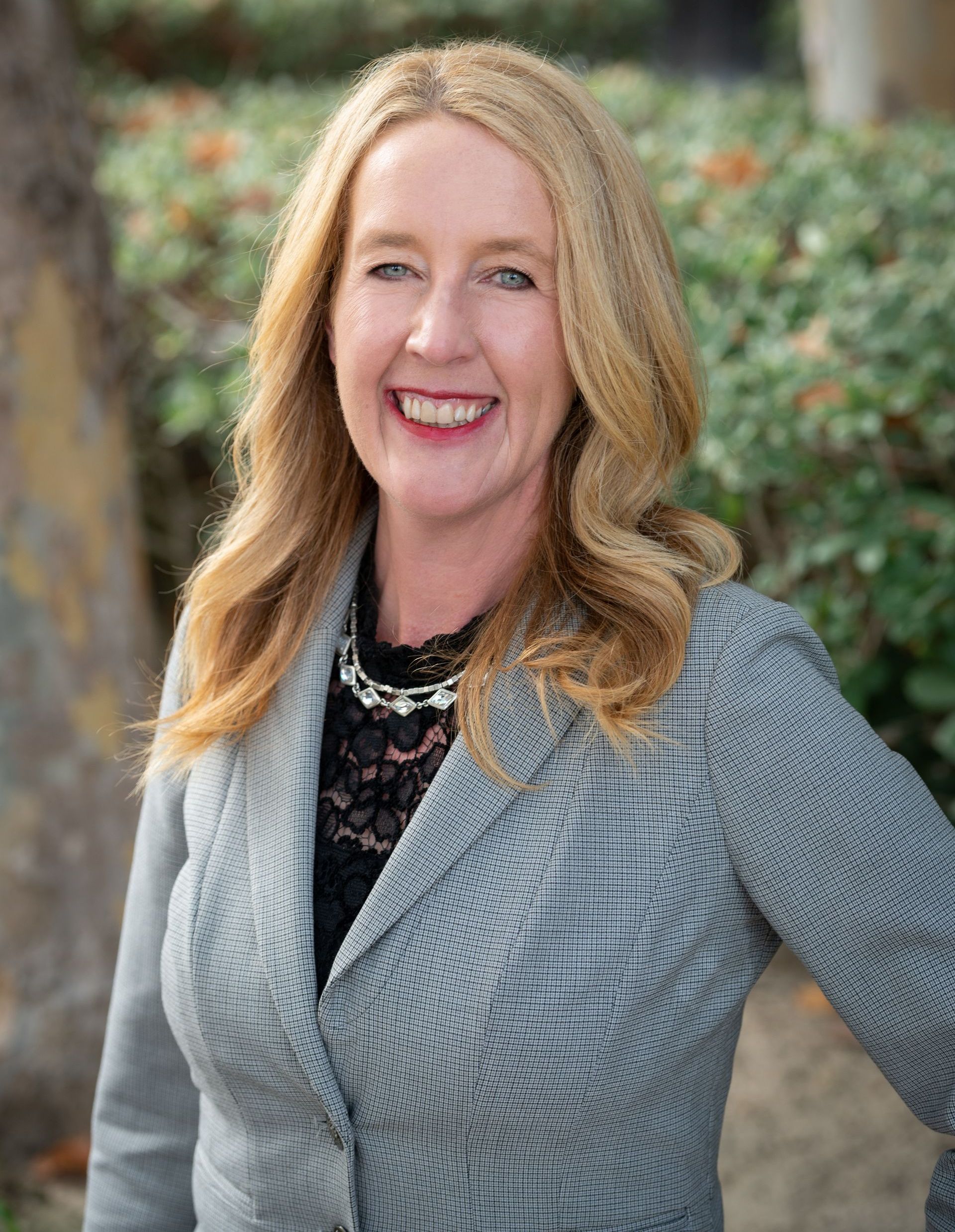 Kaleen Harris, founding partner and president of Harris & McKeown Law Firm, smiling outdoors