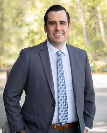Andrew McKeown, Esq., Partner at Harris & McKeown Law Firm, wearing a suit and tie