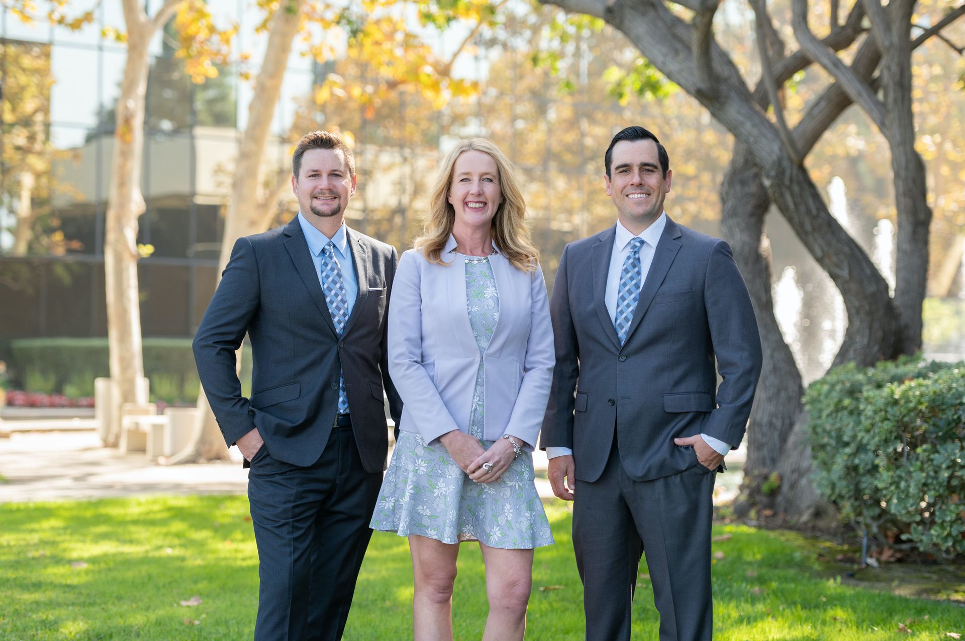 Michael Jakovich, Kalen Harris, and Andrew McKeown standing outdoors in business attire