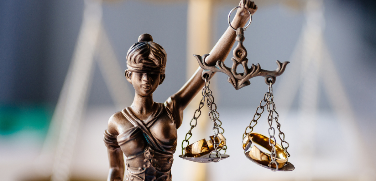 Statue of Lady Justice holding scales, symbolizing law and justice.