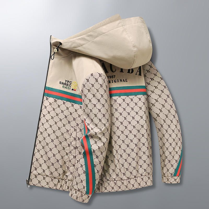 A black jacket with a hood and a pattern on it