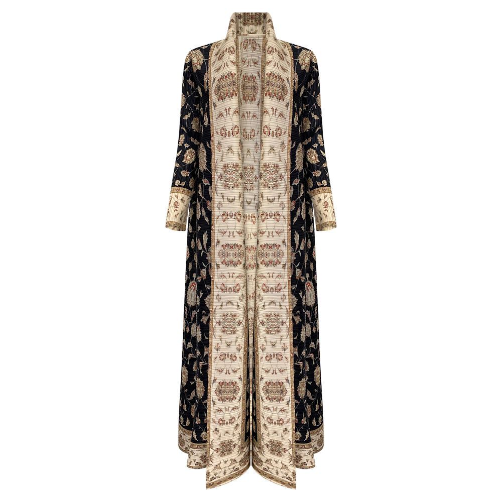 A black and white dress with a floral pattern on it is on a mannequin.