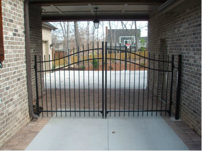 Installed Aluminum Fence on a Bricked Wall — Greenville, SC — Pioneer Fence in Greenville