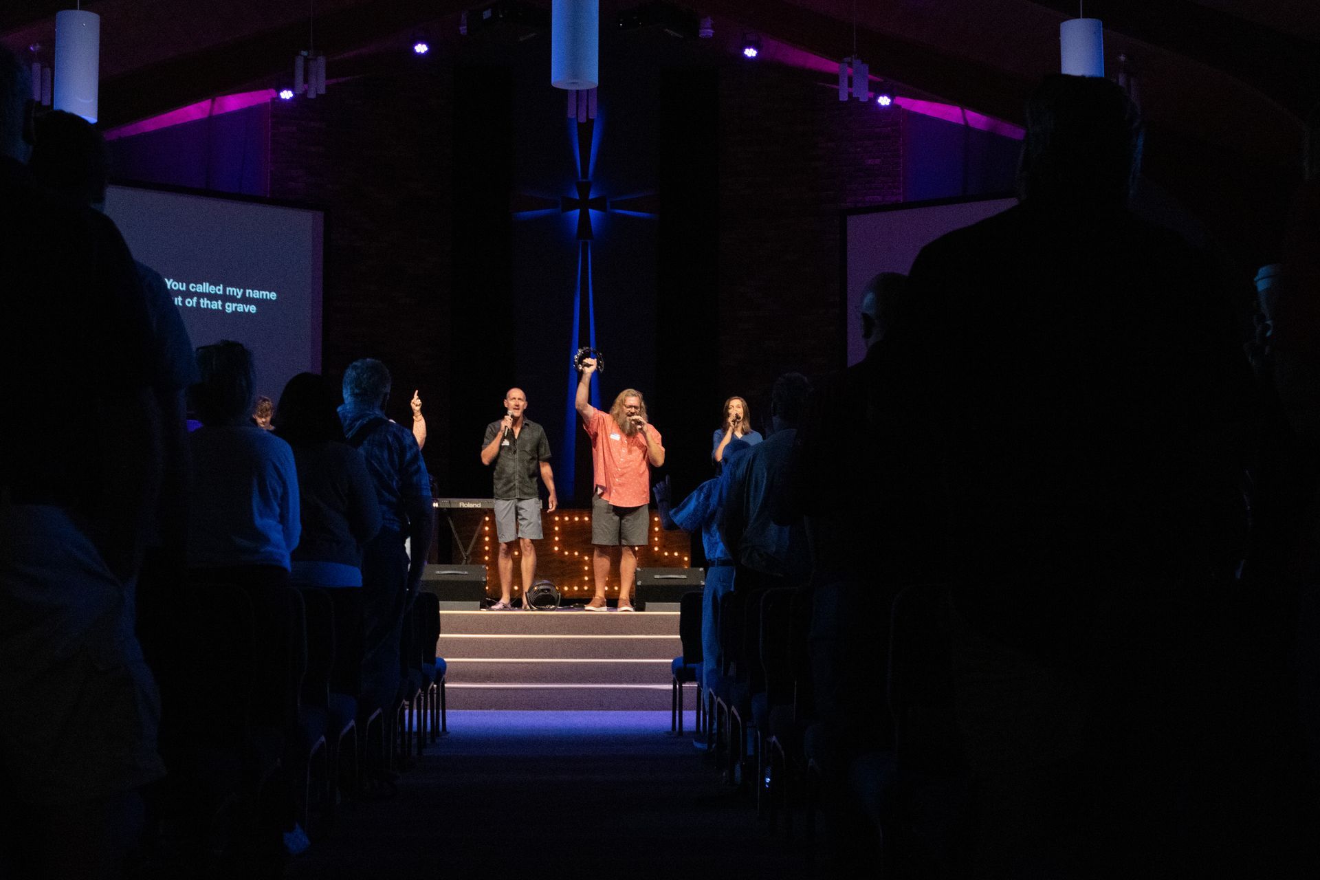 A man is playing drums in a recording studio.
