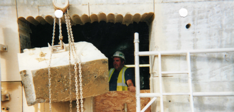 contractor cutting the stone with a drilling equipment