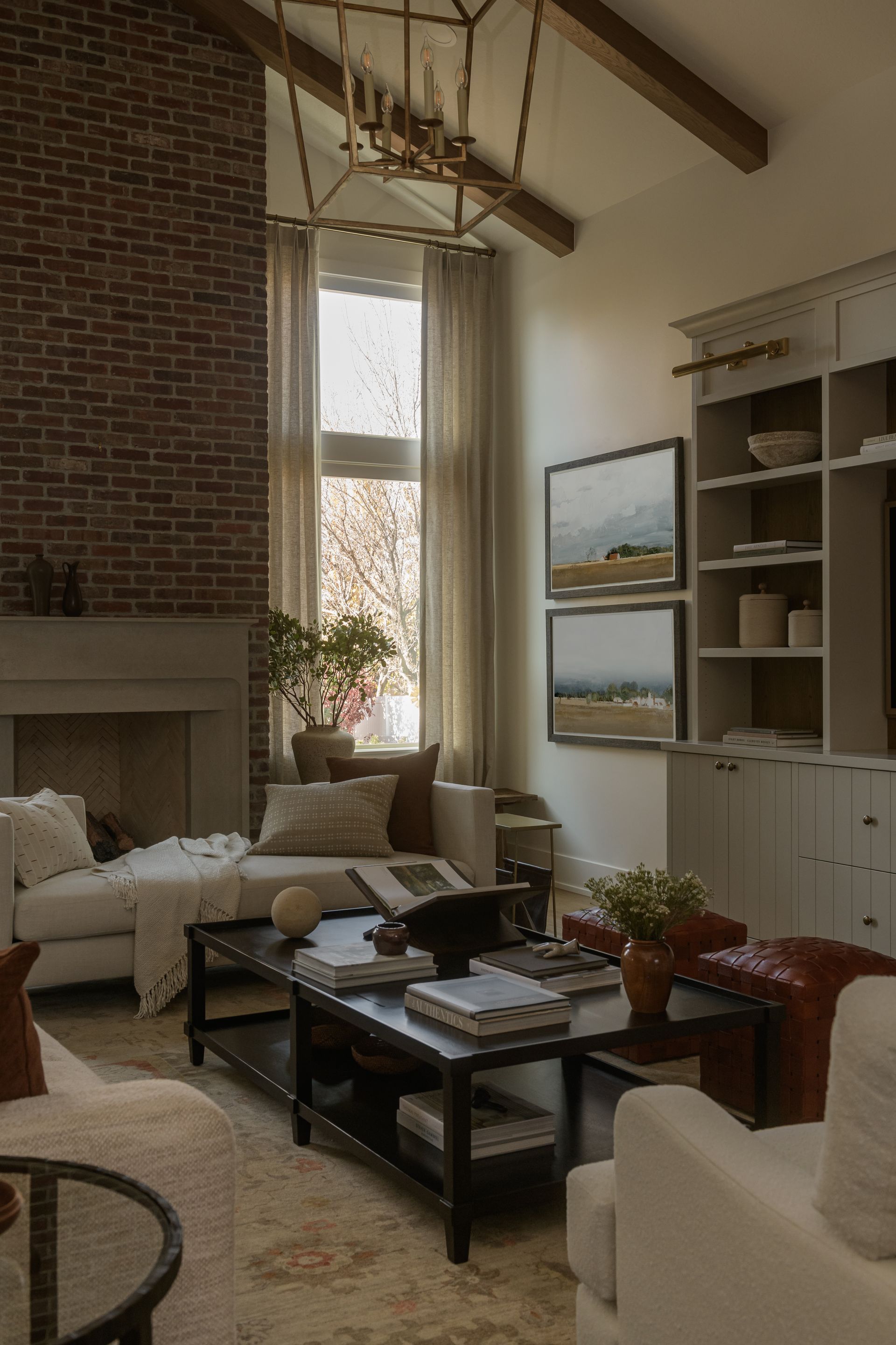 Large window with patterned drapes beside a modern exterior view with palm trees