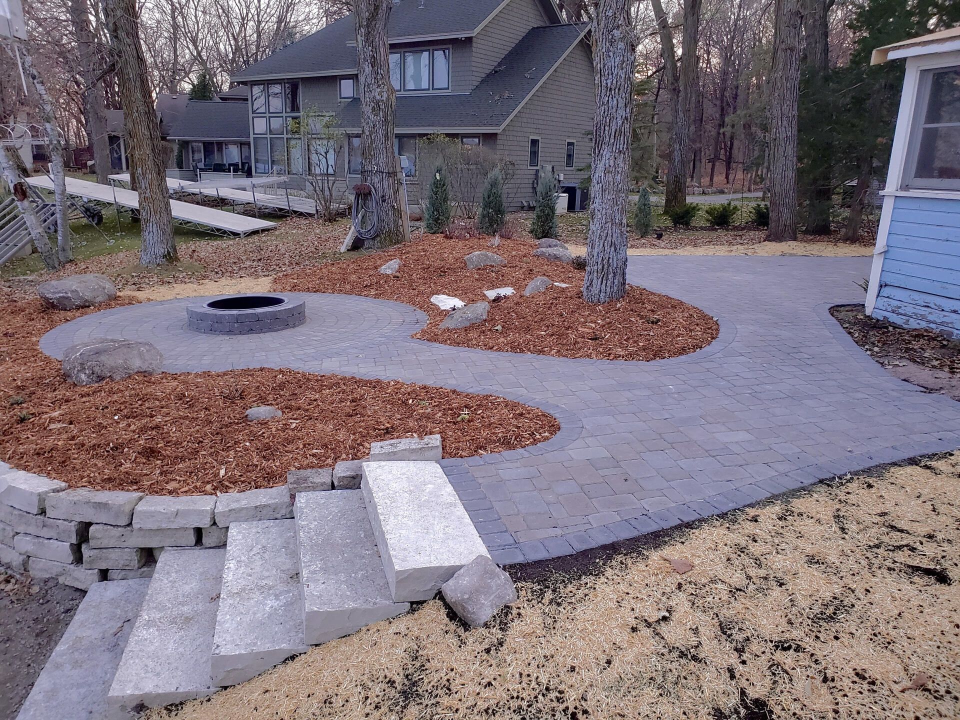 Garden with Stone Steps and Fire Pit — Annandale, MN — OTS Grading and Landscaping LLC