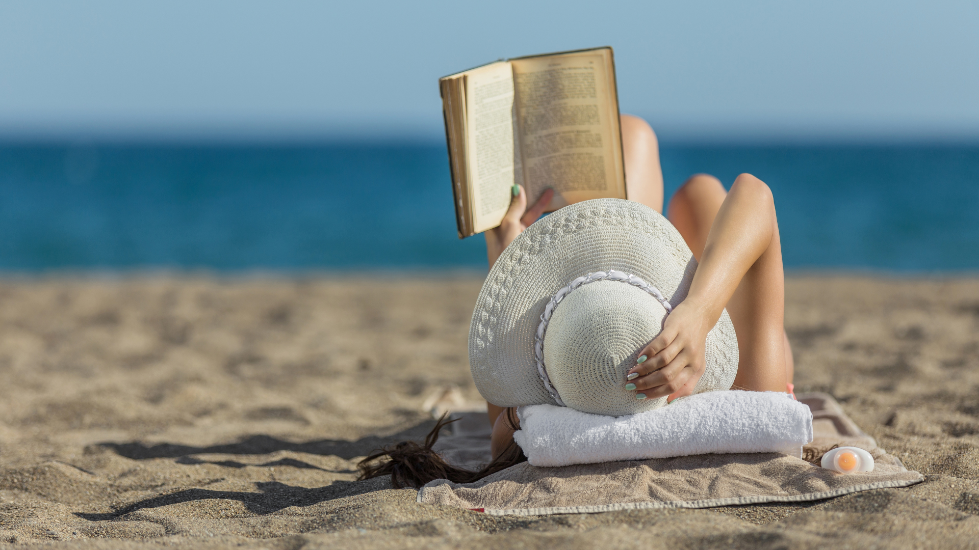 Woman reading a book on Holiday