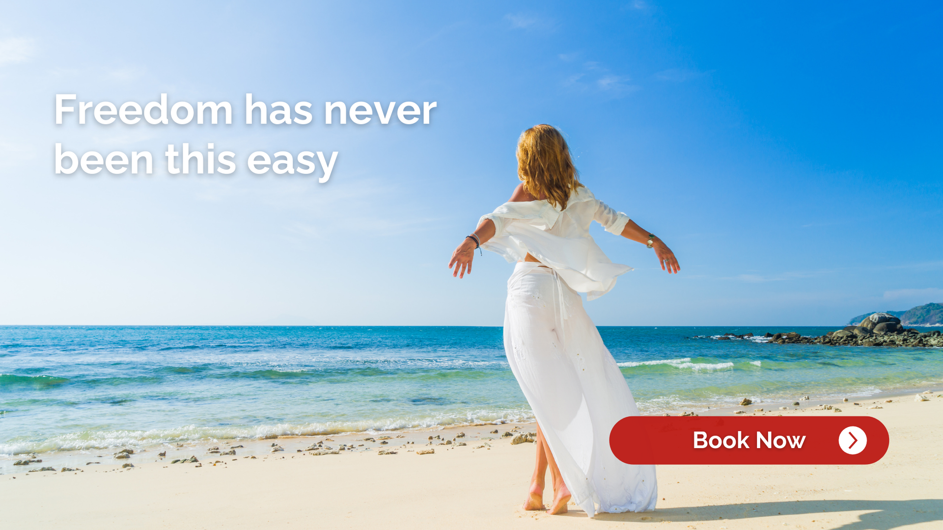 Woman in white on a beach with arms outstretched, blue sky and sea, red 