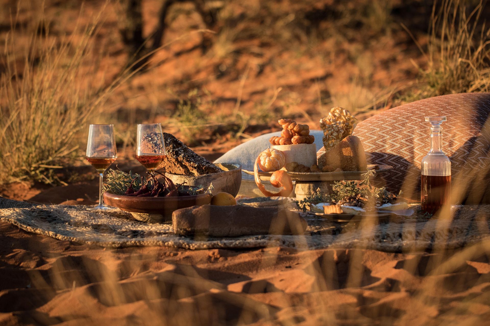 There is a picnic table in the middle of the desert. Malaria Free Safari Destinations