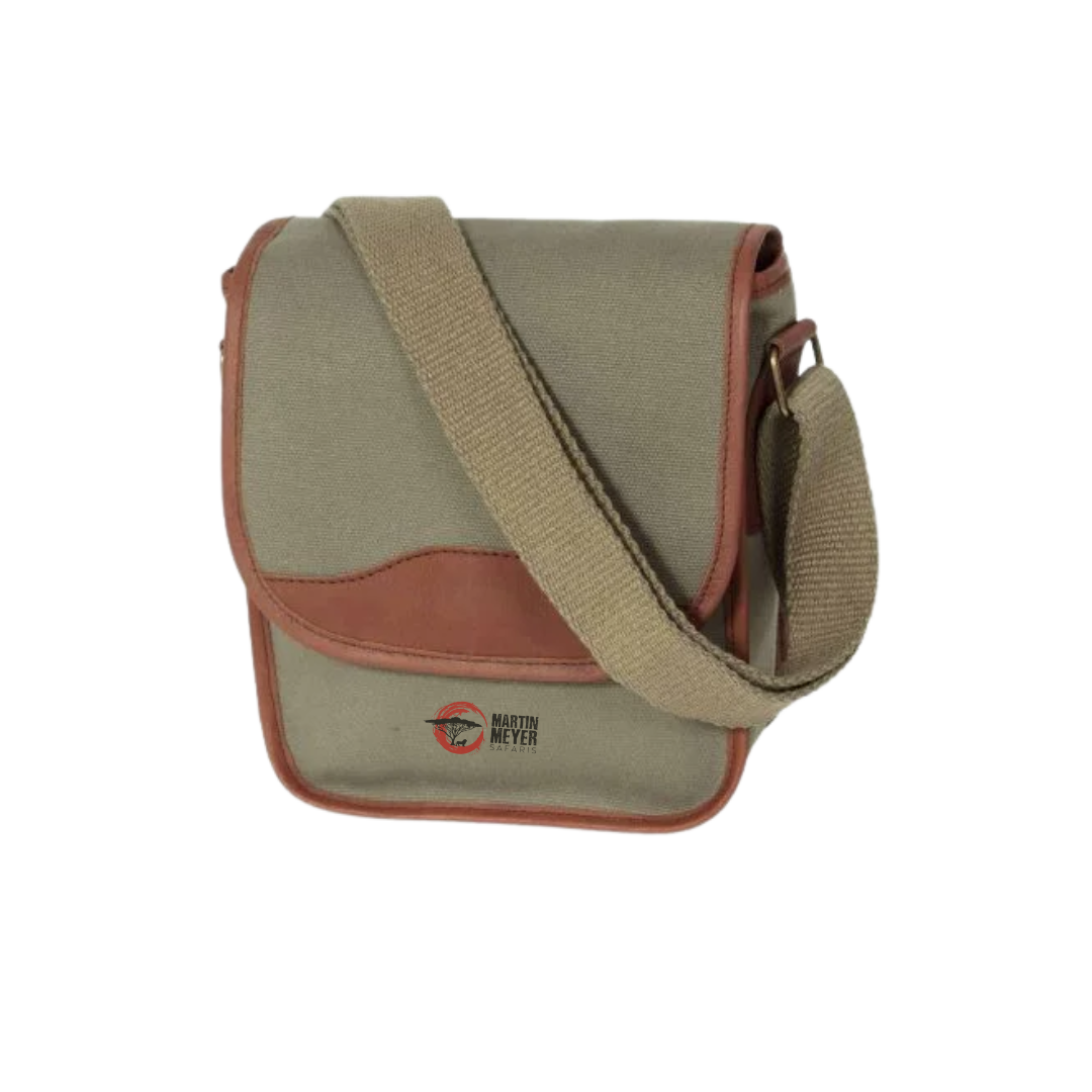 Green canvas messenger bag with brown leather accents and strap.
