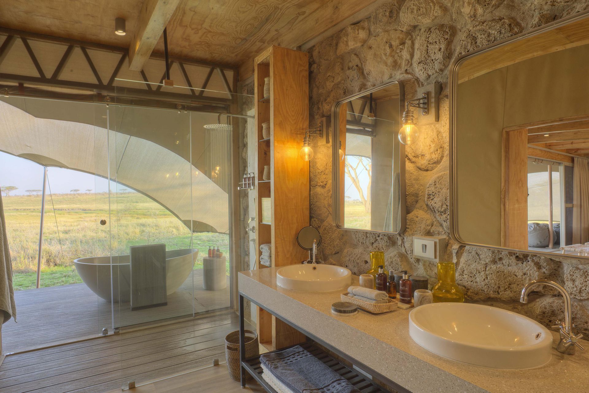 A bathroom with two sinks and a large mirror.