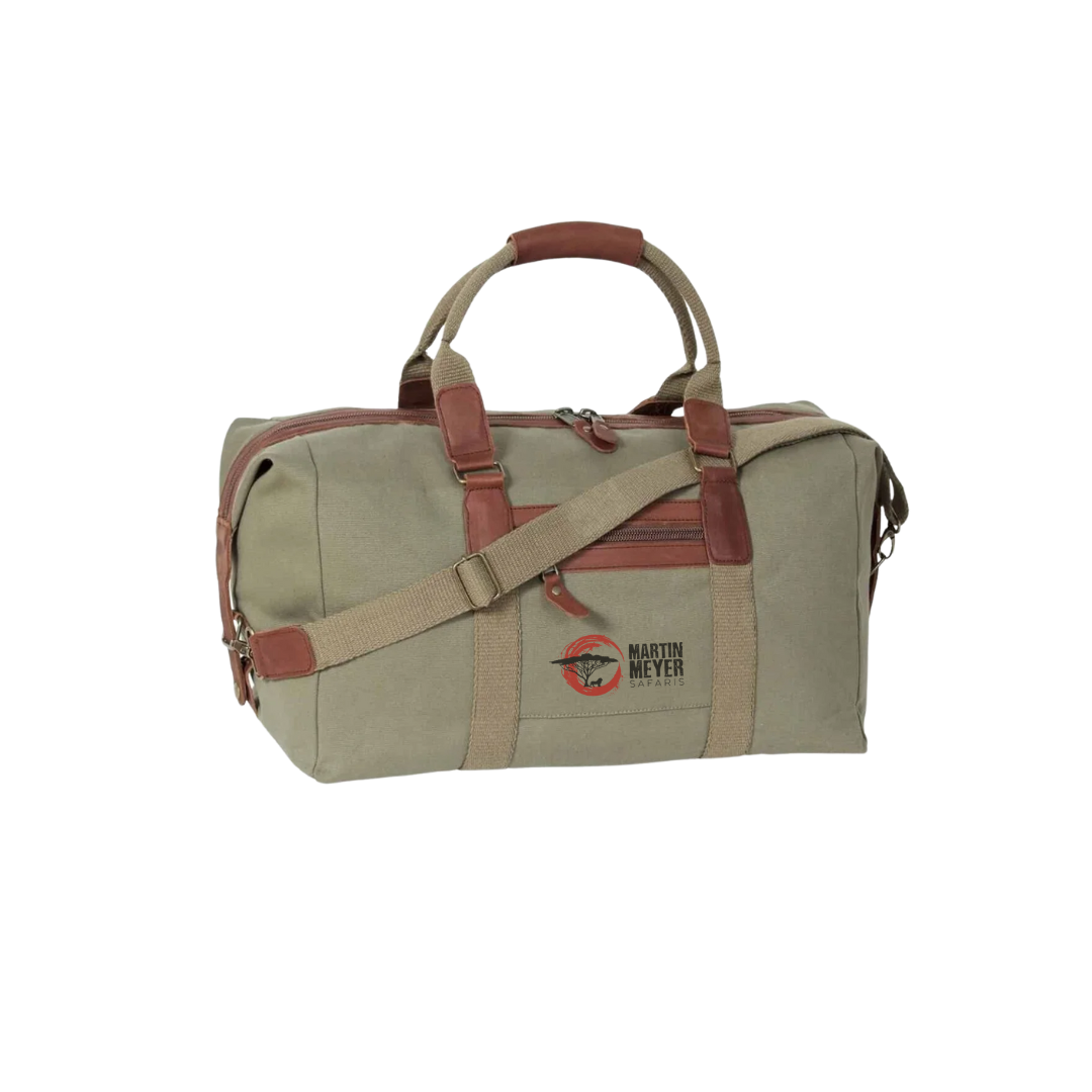 Green canvas duffel bag with brown leather accents and straps.