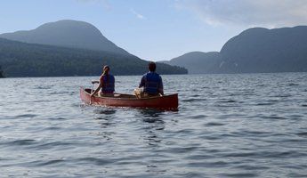 Canoeing Couple on Lake Willoughby in Northern Vermont