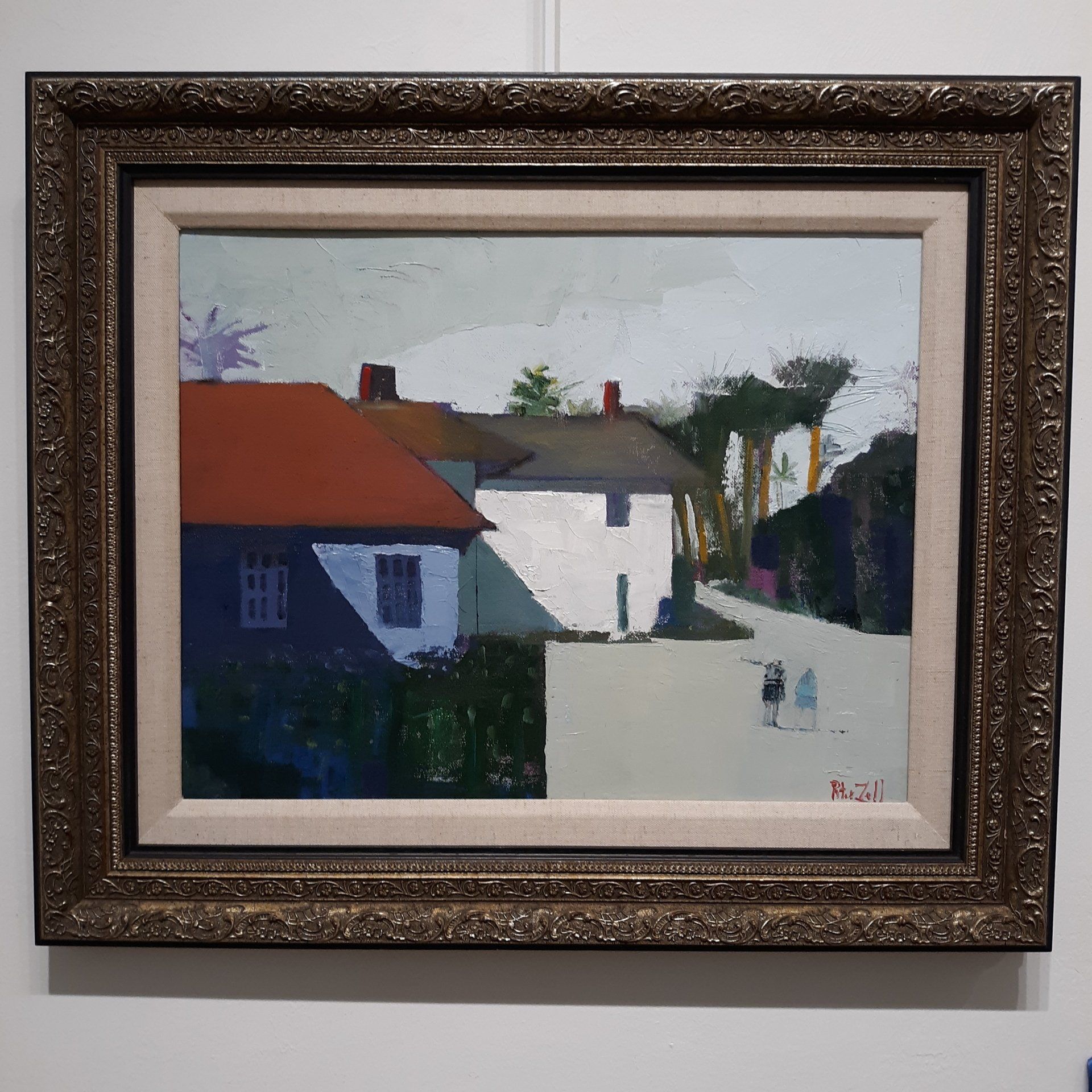 Oil painting of a street scene: buildings, a red roof, figures walking, framed.