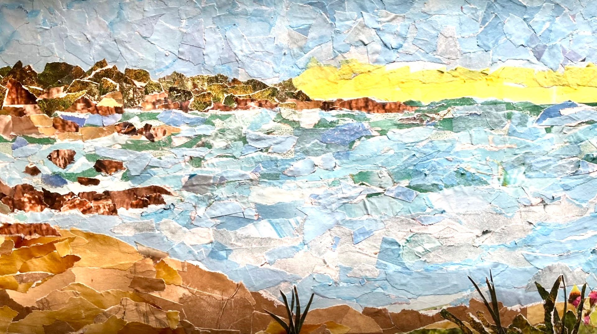 Coastal collage: waves crashing on the shore; tan sand, brown cliffs with green trees, blue sky.