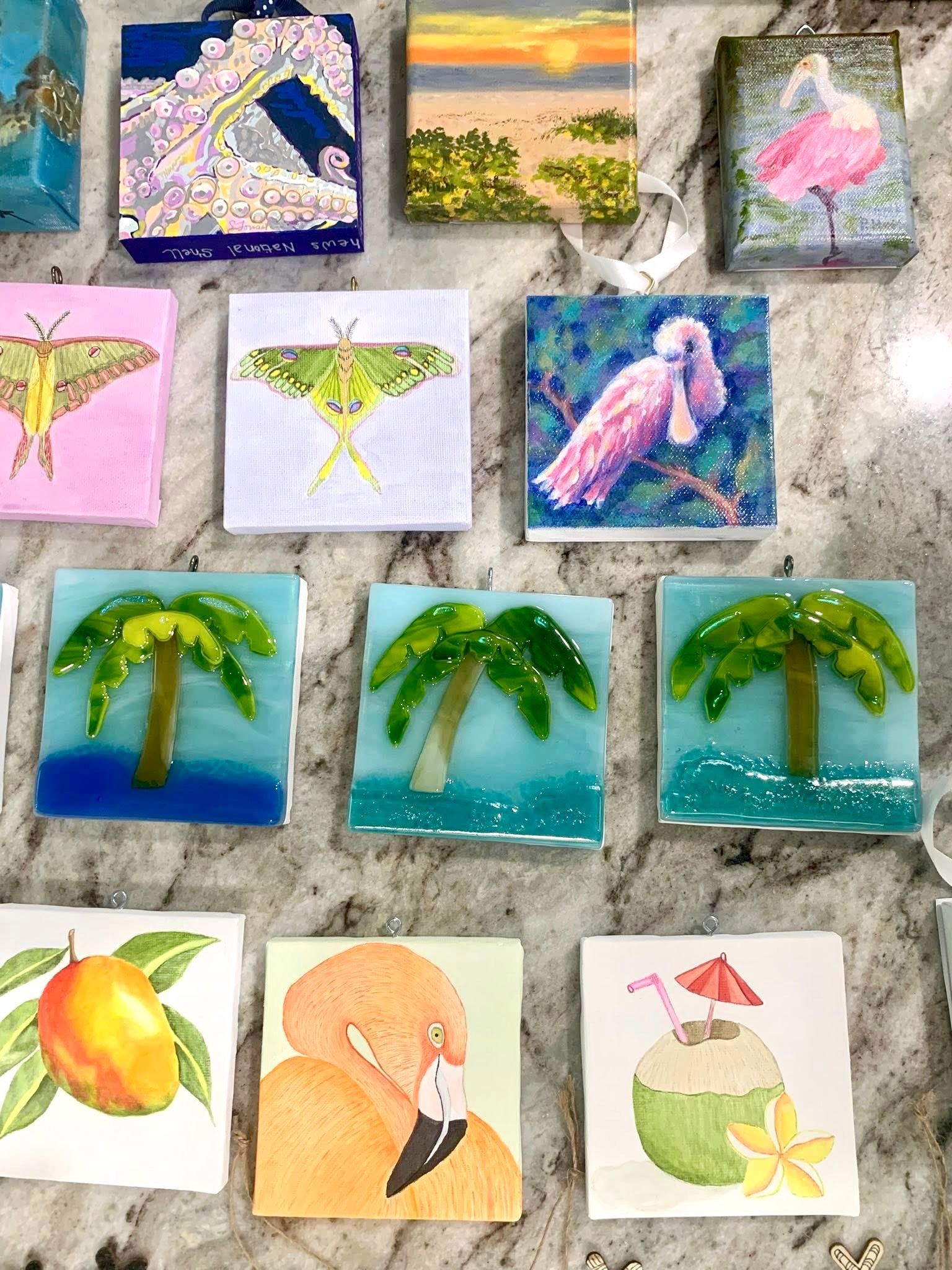 Collection of colorful, square, mosaic art pieces depicting various nature scenes.